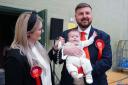 Labour candidate Chris Webb celebrates with his wife Portia and baby Cillian Douglas Webb (Peter Byrne/PA)