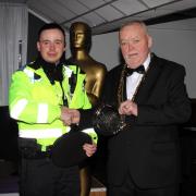 Uniformed Services Worker of the Year PCSO Lewis Railton is presented with his award by Mayor Ernie Welch