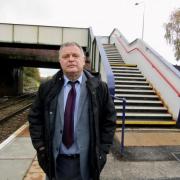 Mike Amesbury in front of the steps he says are an unnecessary obstacle for passengers with limited mobility