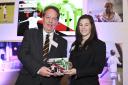 John Peplow receiving the Volunteer of the Year prize from England Women’s international Tammy Beaumont