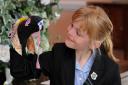 Jessica Brudenell, her sock dinosaur and her Blue Peter badge