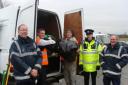 Christopher Bell, 18 and Asa Garner 18, load some of the rubbish into the van watched by Community Payback Work Supervisors, Terry Purcell and Mike Connelly and PCSO Stuart Bradshaw.