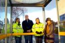 Stephen Dent joins members of Middlewich Clean Team to survey the damage at the vandalised bus shelter in Warmingham Lane.