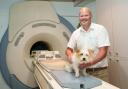 Surgeon Charlie Sale with Ruby and the MRI scanner