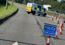 Police at the scene of the A556 sinkhole