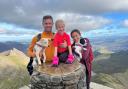 Olivia Grannell climbed Snowdon with parents Paul and Laura and their dogs, Daisy and Asana, for an animal rescue