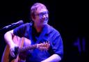 Ocean Colour Scene's Simon Folwer on stage with his acoustic guitar