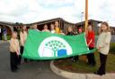 Kingsmead Primary School's Eco Group raise the flag. Left to right are Samuel Harding, eight, Catherine Duncalf, 10, Josh Nicholson, 11, Hannah Crane, 10, Anja Berg, 10, Georgia Williams, 11, Kate Oliver, eight, Laura Taylor, nine, Amelia Whitehead,