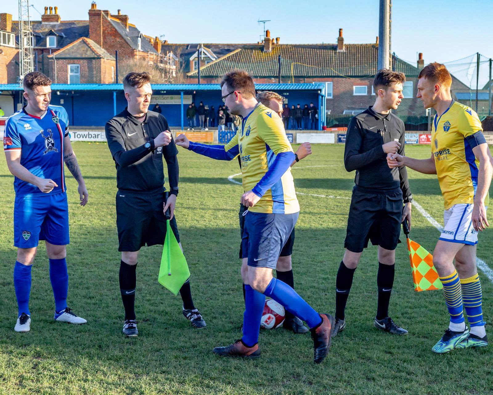 Tom leads the pre-match handshakes. Picture by Brian Murfield