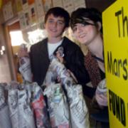 Brother and sister Christy, 13, and Casey Wronko, 18, raffle bottles of water and wine to raise money for Jake.