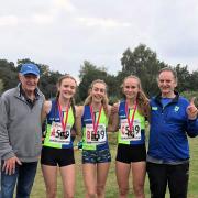 From left, coach Andy Carter, Hope Smith, Holly Weedall, Grace Roberts and coach Shaun McGrath after their national title win