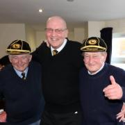 Ron McLaverty, left, and Roger Blake, right, proudly wearing their life members' caps with chairman Ken Jones. Picture: Ken Houghton
