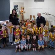 Staff and children at Building Blocks Day Nursery celebrate retaining an Outstanding Ofsted rating