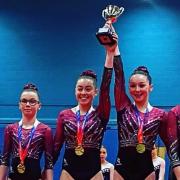 Hattie Hartley, far left, and Edie Coyle, second left, with their gold-medal winning north west team in Stoke on Saturday