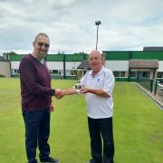Glynn Cookson receiving the Joe Robinson Trophy from Mid Cheshire League chairman Mark Winnington
