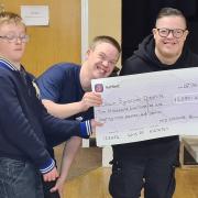 The Mid Cheshire Bowling League cheque being received on behalf of Down Syndrome Cheshire