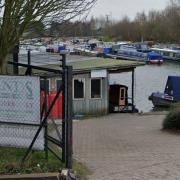 An inquest has opened after a man was found dead at Uplands Basin Marina