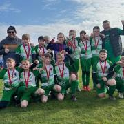 The Northwich Victoria under 12s team celebrate winning the President's Cup