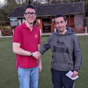 Winner Ian Wassell, right, is congratulated on his victory in the Shavington Social Club open bowls competition by tournament organiser Adam Bloor