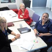 Jayne Pullar, left, of the trust’s work and enterprise team, with Terri Yarrow, right, watched by employment advisor Christine Gould
