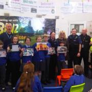 Year Six Moulton Primary School pupils, Paul Davis, from the council’s Streetscene service, PCSOs Kat Stock and Steve Bishop, Clr Helen Weltman, and community safety wardens Alan Melbourne and Pete Harding.