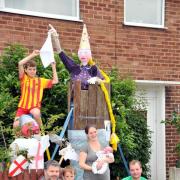 The two families show off their scarecrows. Pictured, from left, are Dylan Darlington, nine, Adam Darlington, Jacob Darlington, two, Laura Forshaw and baby Eli, Piper Forshaw and Gavin Forshaw.