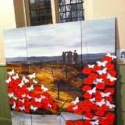 The painting decorated with poppies and butterflies