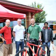 Steve Hall, from Gadbrook Park's Bike to Work Day, and Richard Wilding, from Wild Bikes, with Mark Bowyer, from Roberts Bakery, who won first prize of a bike for taking part in the initiative and Elangovan Anand, from The Hut, who won third prize.
