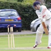 Middlwich batsman Leandro Du Toit is bowled by Timperley's Jack White on Saturday. Picture: MATT SAYLE