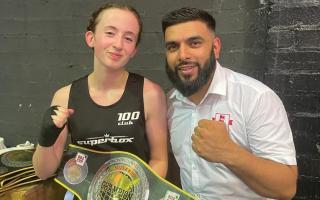 Bella Dempsey receives her belt from an England Boxing offical in Birmingham on Sunday