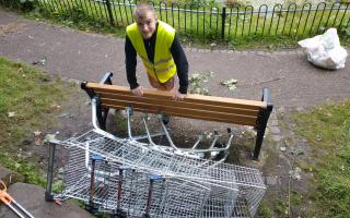 Hundreds of trolleys have been dumped in Winsford Town Park over the past five years. Town Council groundsman Alfie Grayson collects four more on Friday