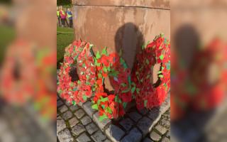 Pupils at Kingsmead Primary School laid wreaths made of recycled paper poppies