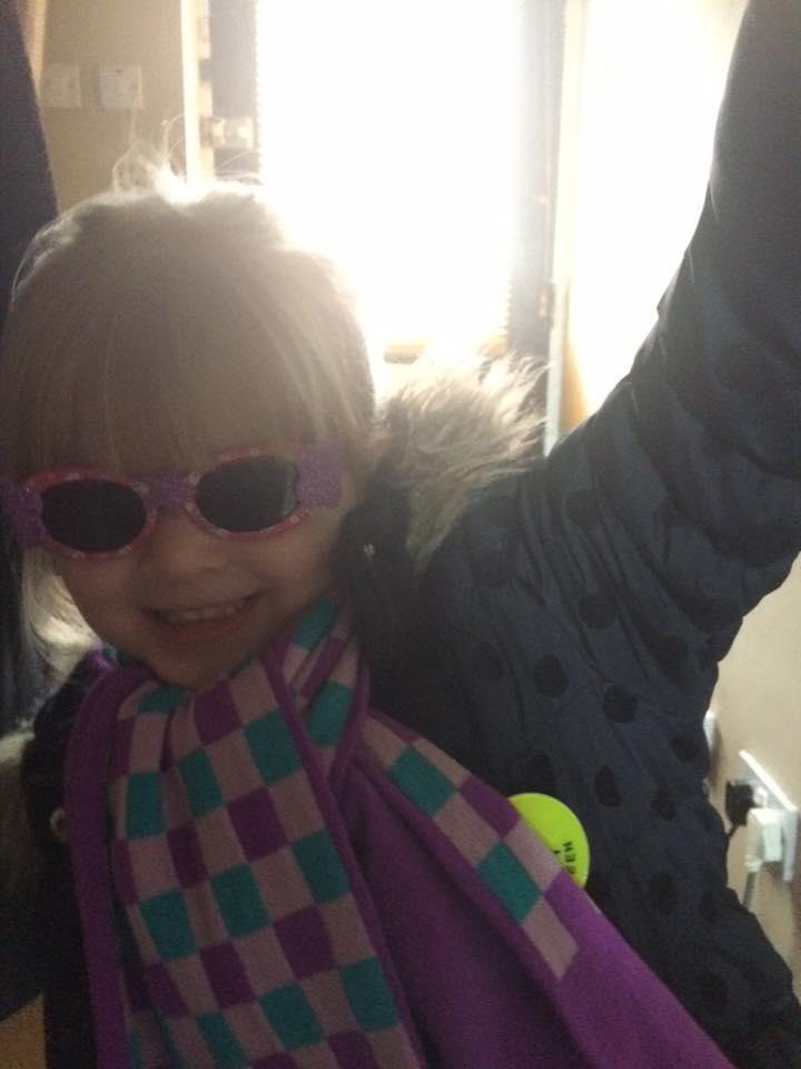 Millie, age 3, wears wacky glasses at Witton Church Walk Primary School