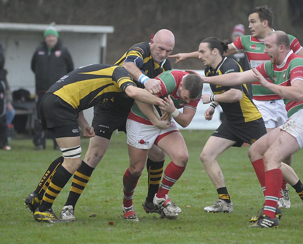 John Dudley, left, and Robin Houghton apply pressure to a Warrington ball-carrier on Saturday.. Picture: Mike Boden