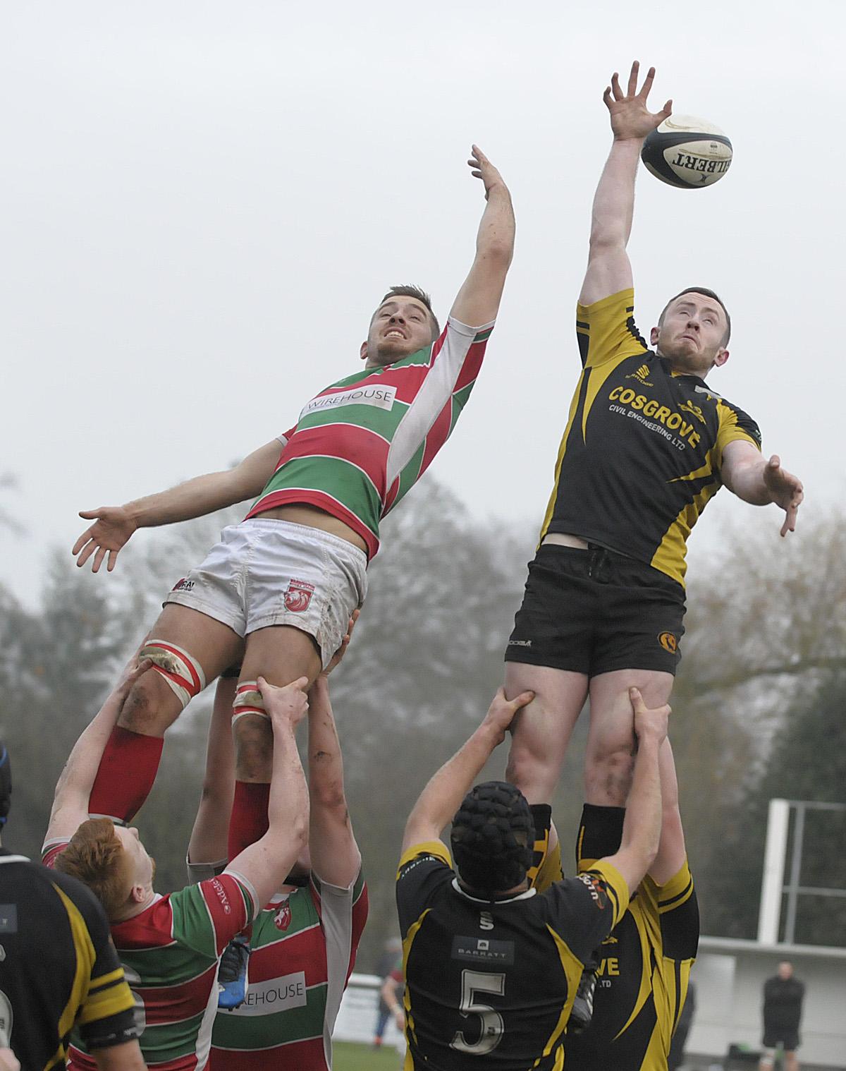 Jonny English, right, reaches skywards at a lineout during Northwich's win at Warrington on Saturday.. Picture: Mike Boden
