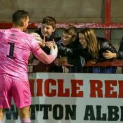 Ollie Martin is congratulated on his goalkeeping heroics by young Witton Albion fans. Picture: Karl Brooks Photography