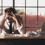 A generic photo of man stressed at work. See PA Feature WELLBEING Immersive Coaching. Picture credit should read: Alamy/PA. WARNING: This picture must only be used to accompany PA Feature WELLBEING Immersive Coaching..