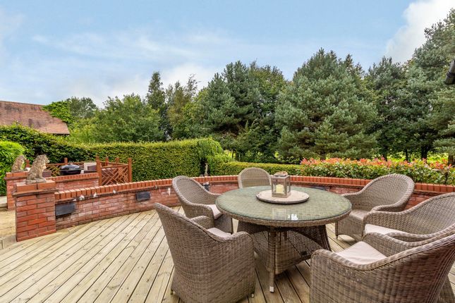 A decked area provides a lovely spot to enjoy a barbecue