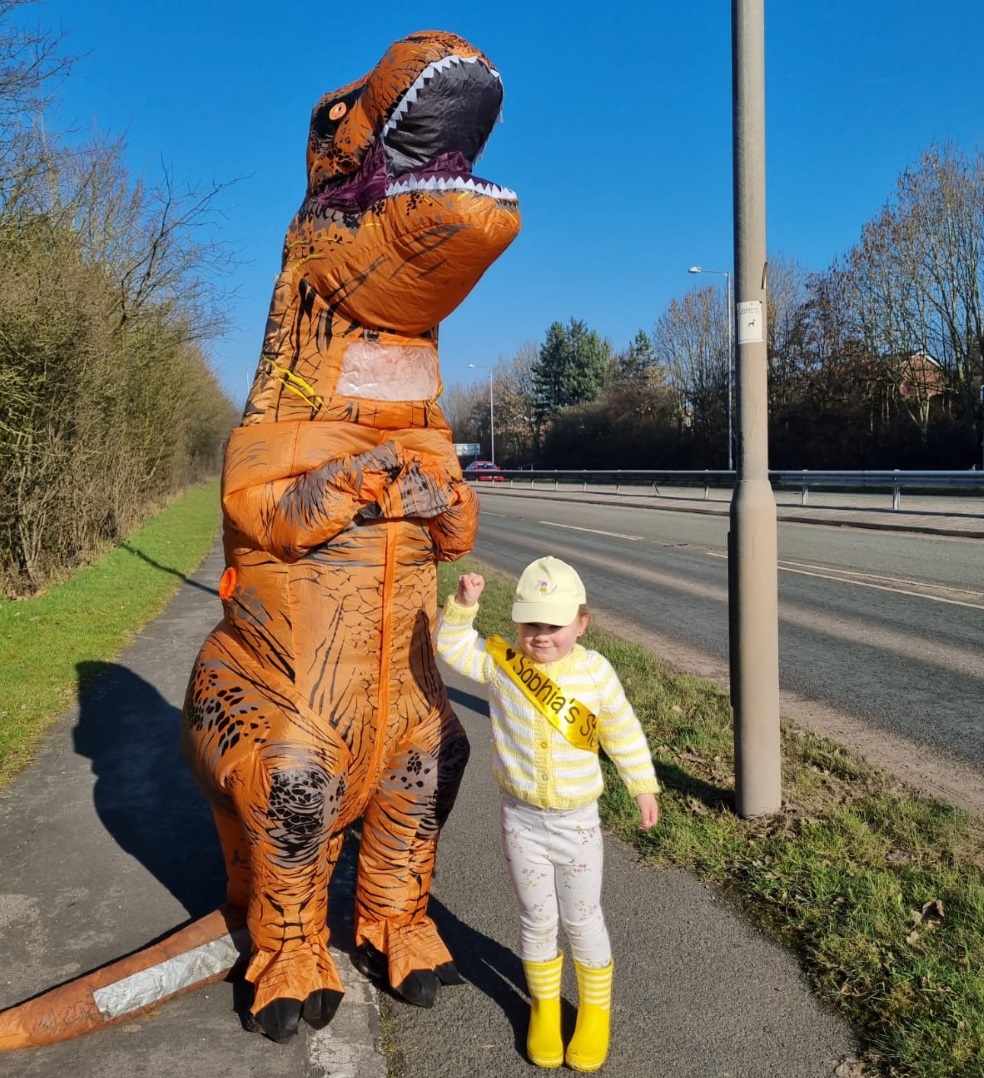 Sophia Ankers walking round Winsford with a dinosaur to lift peoples spirits 