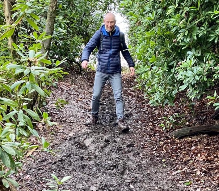Andy Ryder trudges through the mud on a challenging walk