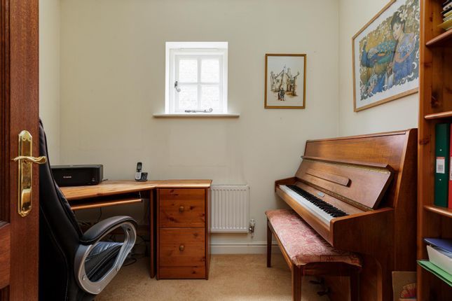 A music room with space for an office