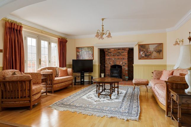 The spacious living room has a feature fireplace