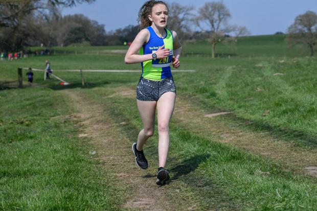 Hope Smith on her way to victory in the under 15s girls at the Cheshire Cross Country Championships 2021. Picture: Mick Hall