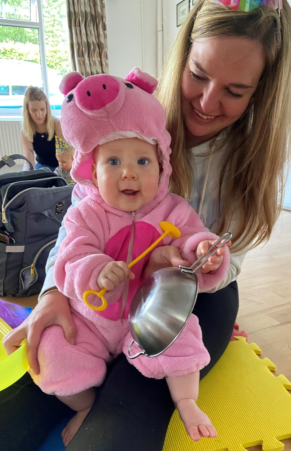 Seven-month-old Ettie Booth enjoys tapping a pan
