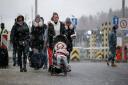 Ukrainian refugees fleeing the conflict (PA)