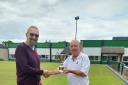 Glynn Cookson receiving the Joe Robinson Trophy from Mid Cheshire League chairman Mark Winnington