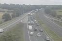 Traffic is growing on the M56 following a vehicle fire