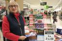 Hilary Edwards-Malam of the Friends of Winsford Town Park, with the Winsford 2024 calendar in Asda, Winsford