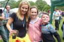 Helen Skelton with Lewis Almond and his worm charming helper.