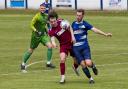 Winsford United (blue) against Sandbach United in the St Luke's Cup Final. Picture: John Clayton